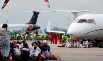 Environmentalists in the Netherlands protest at Amsterdam Schiphol Airport