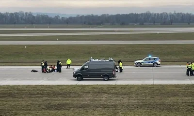 Climate activists glued to the airstrip