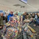 Dutch people line up to buy fireworks at a grocery store in Germany