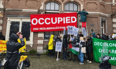 Climate activists occupy a building at the University of Amsterdam over connections to Shell