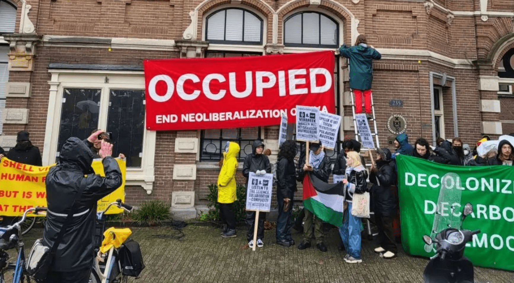 Climate activists occupy a building at the University of Amsterdam over connections to Shell